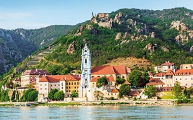 The small town of Durnstein, as seen from the Danube river in Austria